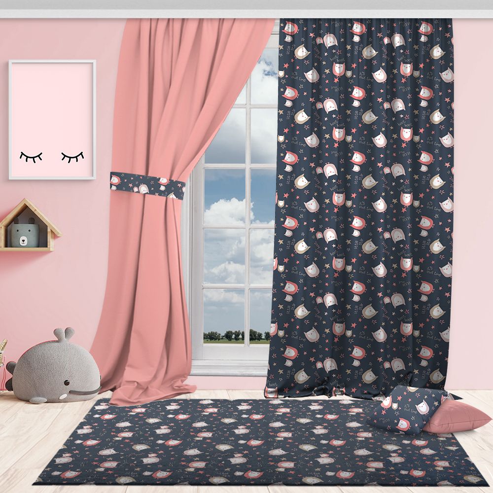 Children’s room with dark blue owl‑patterned curtains paired with pink décor, matching rug and cushion, creating a playful and coordinated owl‑themed bedroom design.