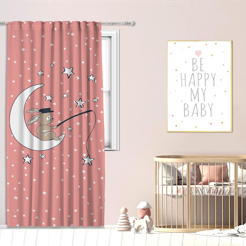 Nursery room featuring a pink curtain with a rabbit sitting on a crescent moon and star motifs, styled with a wooden crib and matching wall art for a soft, dreamy baby room theme.