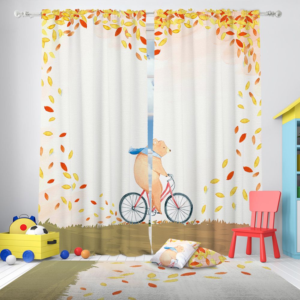 Curtains with a bear riding a bicycle design in a room with toys and a chair.