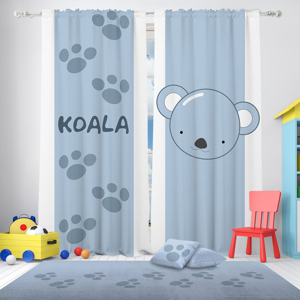 Nursery Curtains with paw prints and a bear design in a child's room.