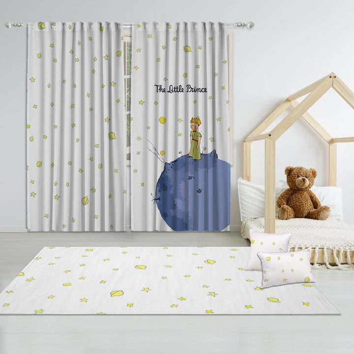 Kids's room with 'The Little Prince' themed curtain, rug, and teddy bear.