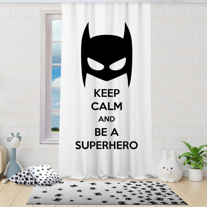 Curtain with Batman logo and 'Keep Calm and Be a Superhero' text in a room with decor elements.