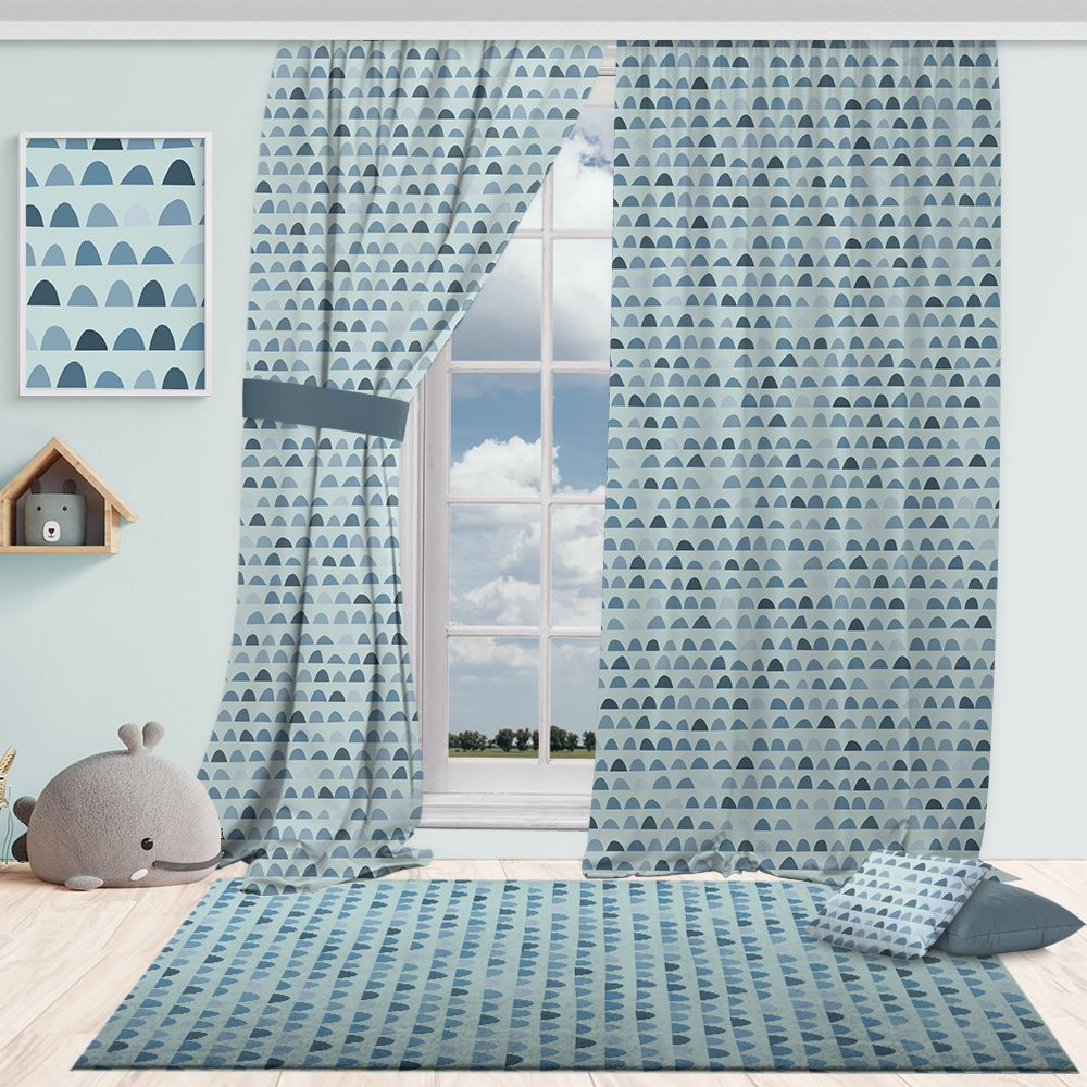 Room with blue tones patterned curtains, rug, and decor items on a light blue wall.
