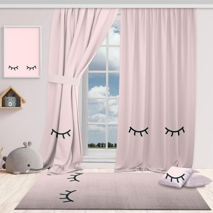 Pink curtains with eye-shaped decorations in a room with a window, rug, and decorative items.