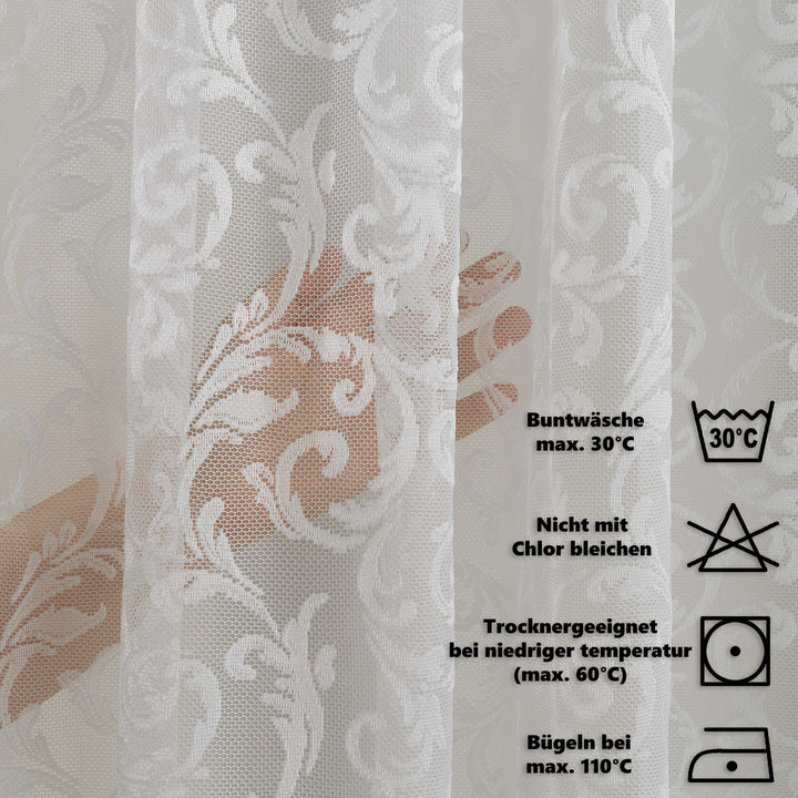 A white sheer voile curtain made to measure, photographed from a soft angle showing its lightweight woven texture and gentle translucent drape