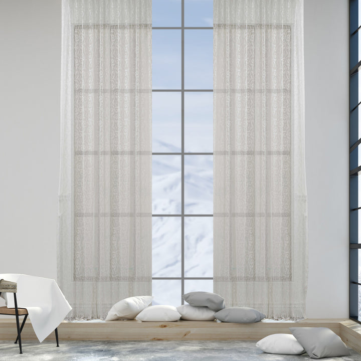 An off‑white ivory voile curtain in extra‑wide width, made to measure with a soft sheer texture and clean flowing drape
