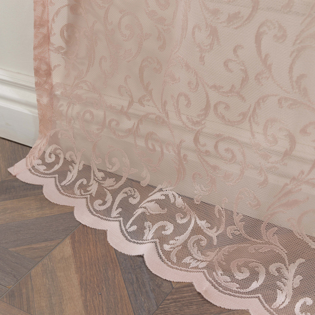 A close‑up of pink sheer voile with scalloped embroidered edging, made to measure with delicate detailing and premium soft light‑filtering performance