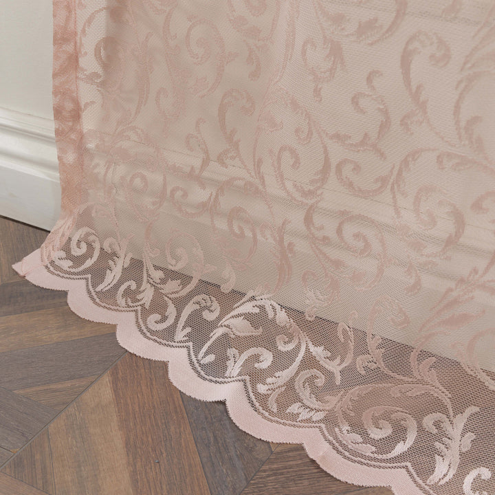 A close‑up of pink sheer voile with scalloped embroidered edging, made to measure with delicate detailing and premium soft light‑filtering performance