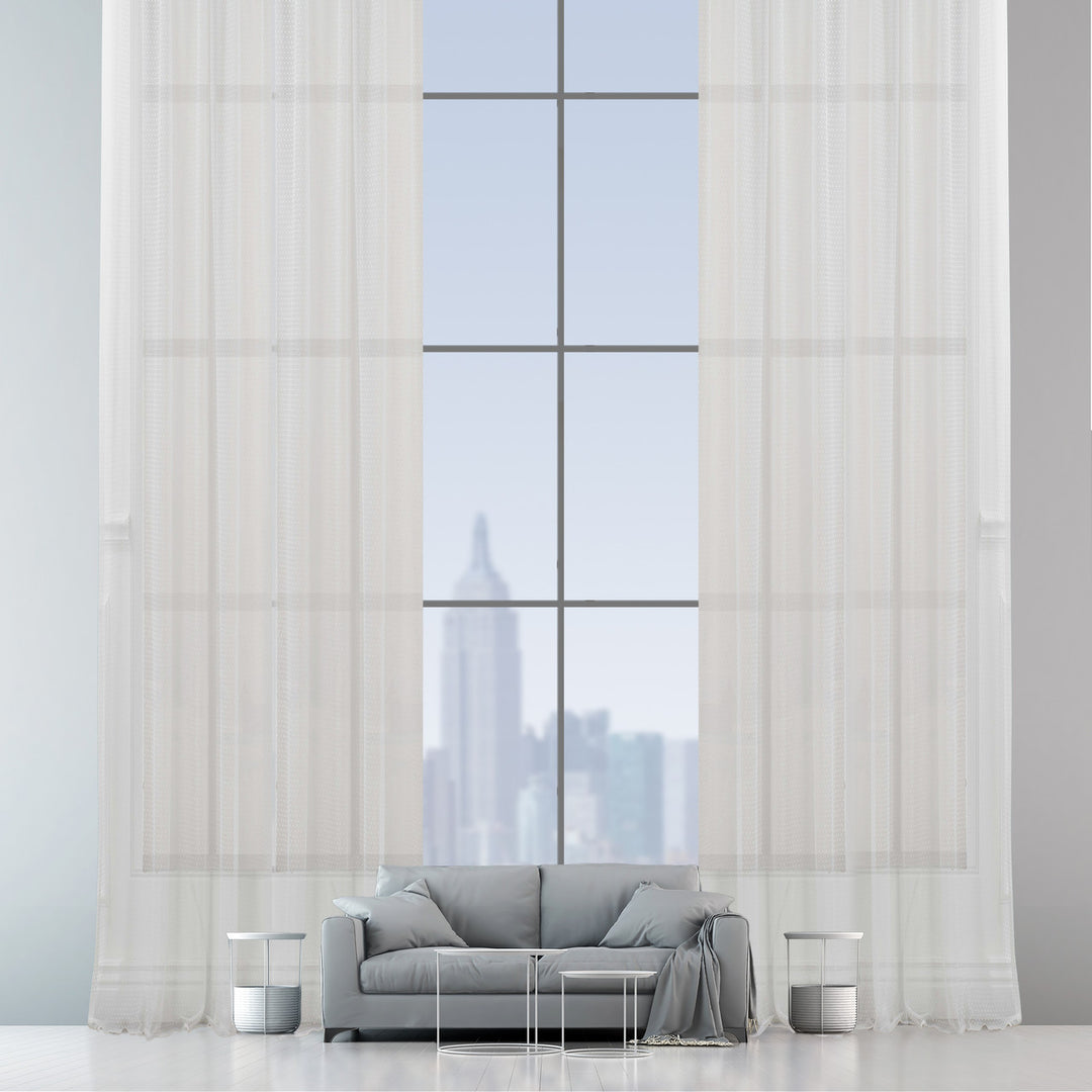 A white polka‑dot sheer voile curtain in extra‑wide width, made to measure with a lightweight airy texture and gentle light‑filtering effect