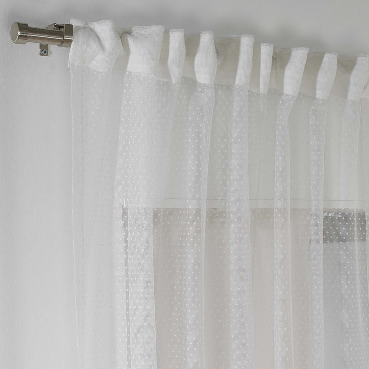 A white polka‑dot sheer voile curtain with a rod‑pocket header, made to measure and shown with a soft flowing drape and translucent finish