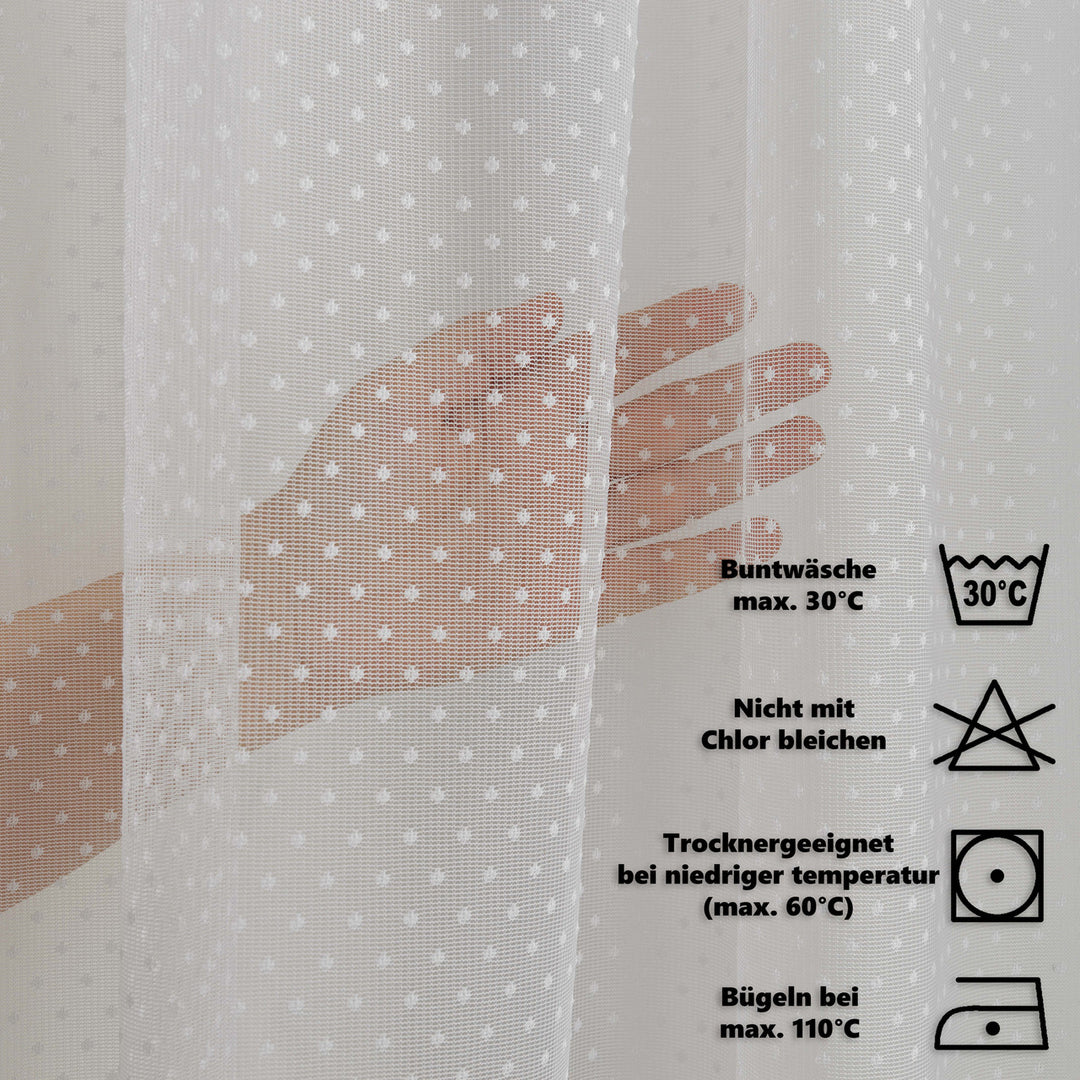 Textile with a hand illustration and laundry care instructions on a light gray background
