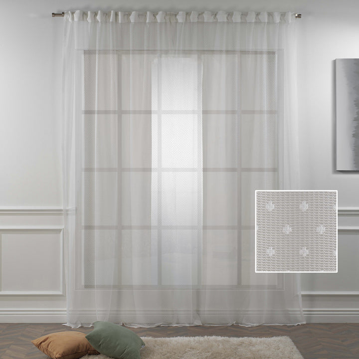 A close‑up of white polka‑dot sheer voile fabric showing its lightweight woven texture, soft translucency and delicate printed dot pattern