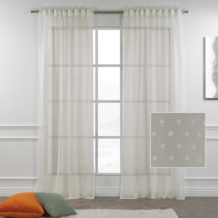  A close‑up zoom of ivory sheer voile fabric with a soft translucent finish and subtle polka‑dot detailing