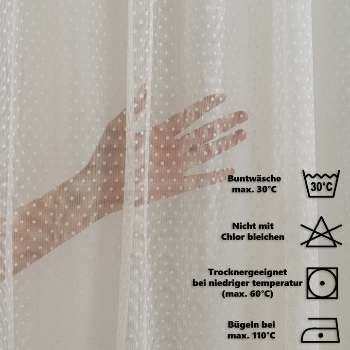 Fabric with a hand illustration and laundry care symbols on a white background