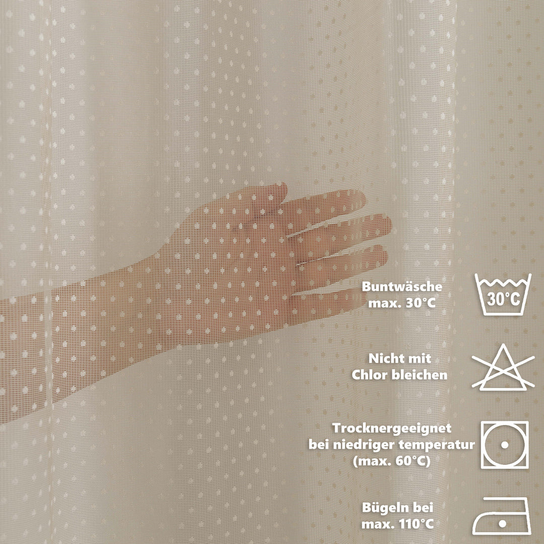 Hand touching a textured fabric with care instructions displayed on the right.