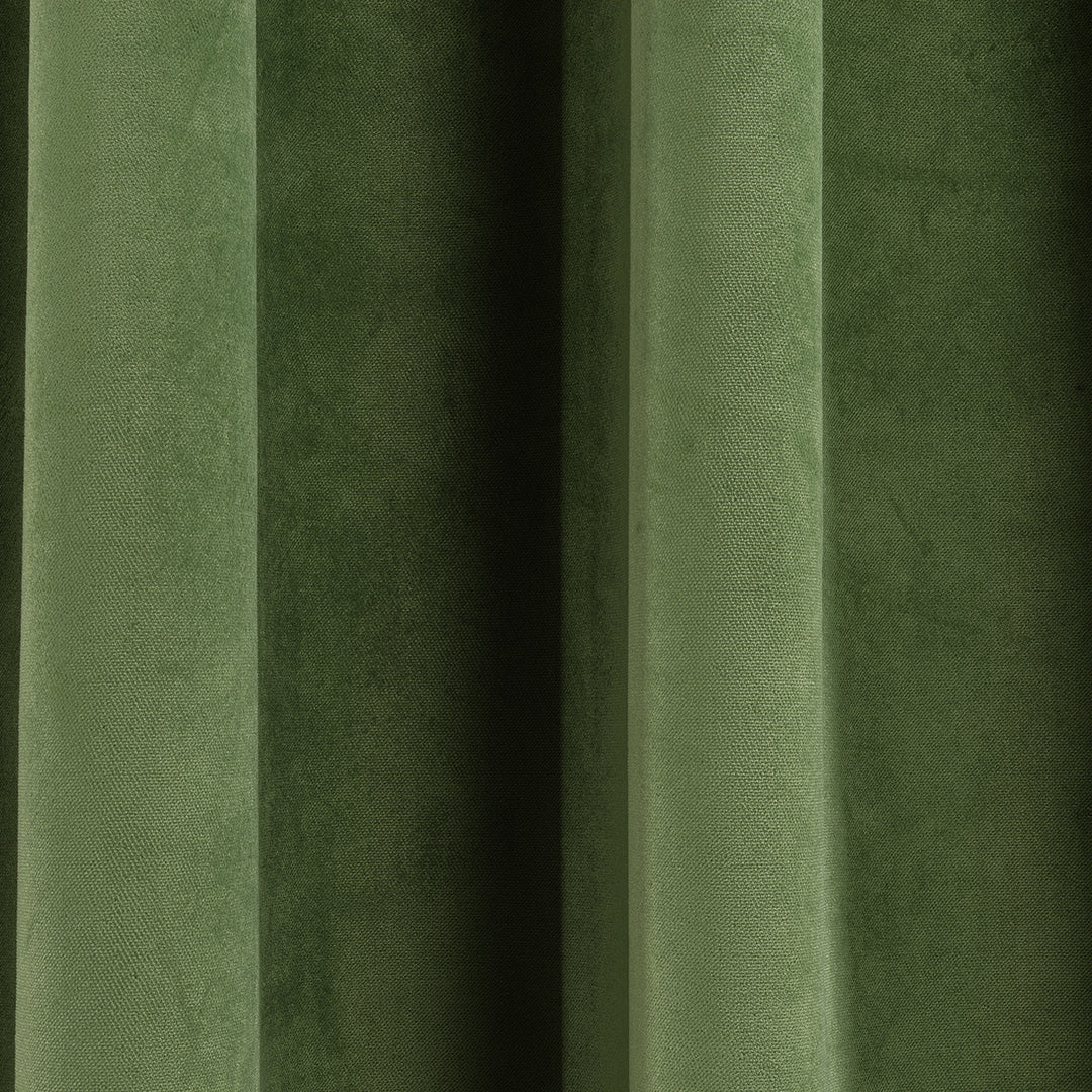 A soft matte velvet swatch in olivine green, showing warm green undertone, smooth pile and matte surface, made to measure and available by the metre.