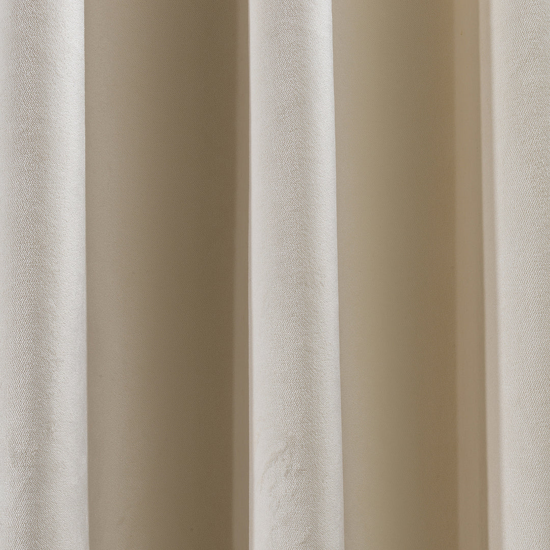 A soft matte velvet swatch in off‑white, highlighting subtle warm undertone, fine pile texture and matte finish, made to measure and available by the metre.