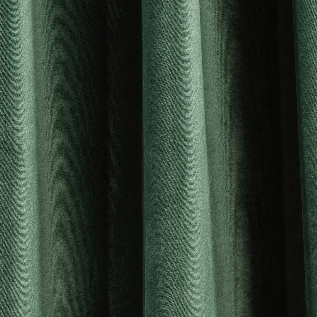 A soft matte velvet swatch in bottle green, showing deep saturated tone, fine pile and matte texture, made to measure and available by the metre.