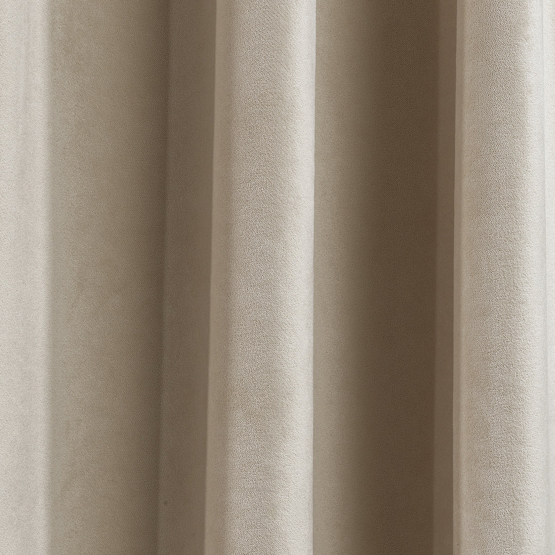  A soft matte velvet fabric swatch in ecru, showing warm neutral tone, smooth pile and refined matte surface, made to measure and available by the metre.