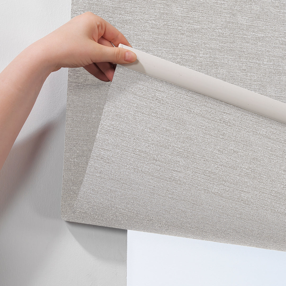  A beige marble‑textured room darkening roller blind made to measure, photographed with a refined stone‑effect finish and balanced dimming