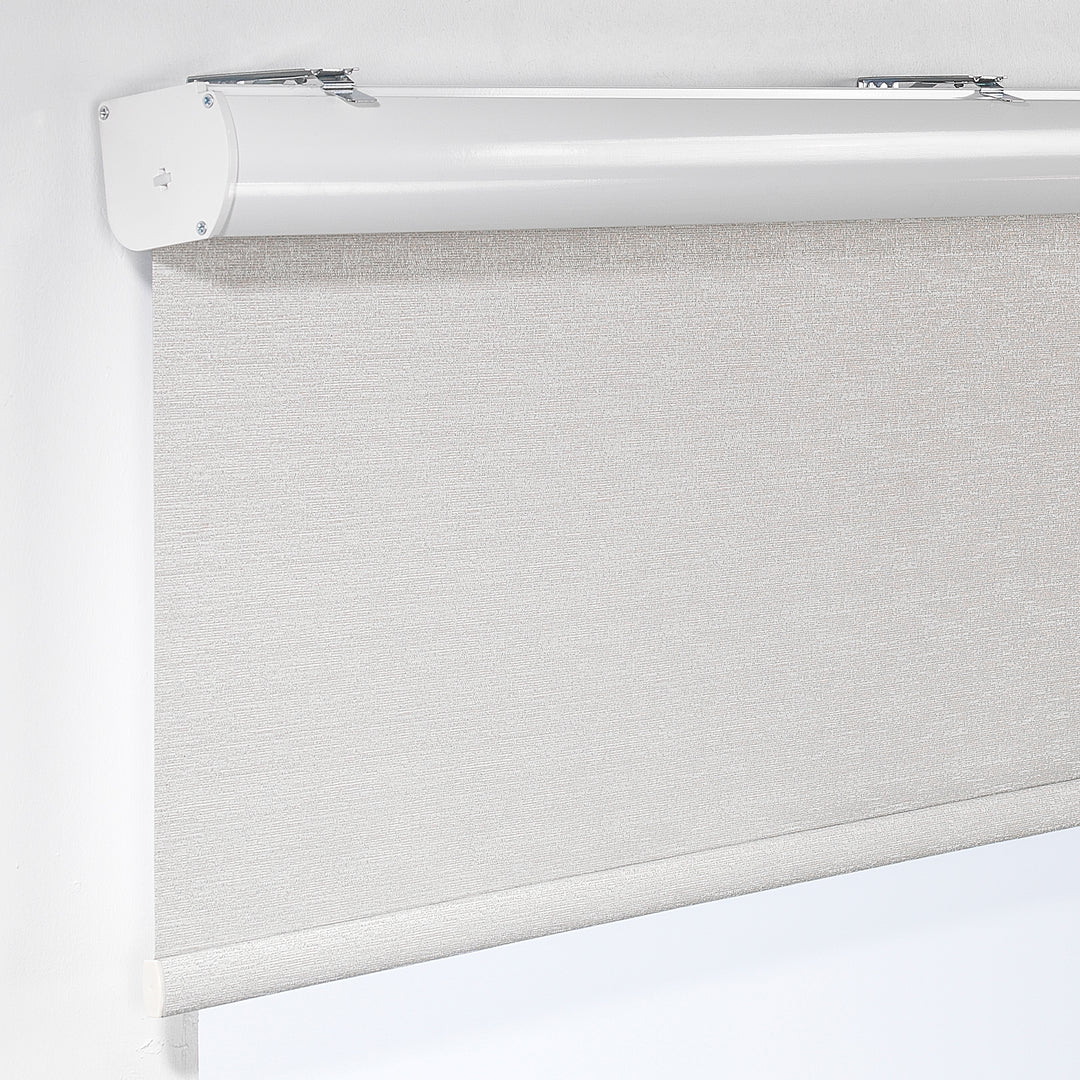 A made to measure beige marble‑textured room darkening roller blind displayed with a natural stone‑look pattern and tidy straight lines