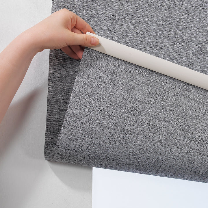A grey marble‑textured room darkening roller blind made to measure, shown lowered with a soft stone‑effect surface and clean minimal edges
