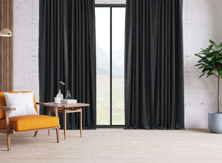 An extra‑long wide linen‑look door curtain in anthracite, highlighting smooth tailored folds and a deep refined finish