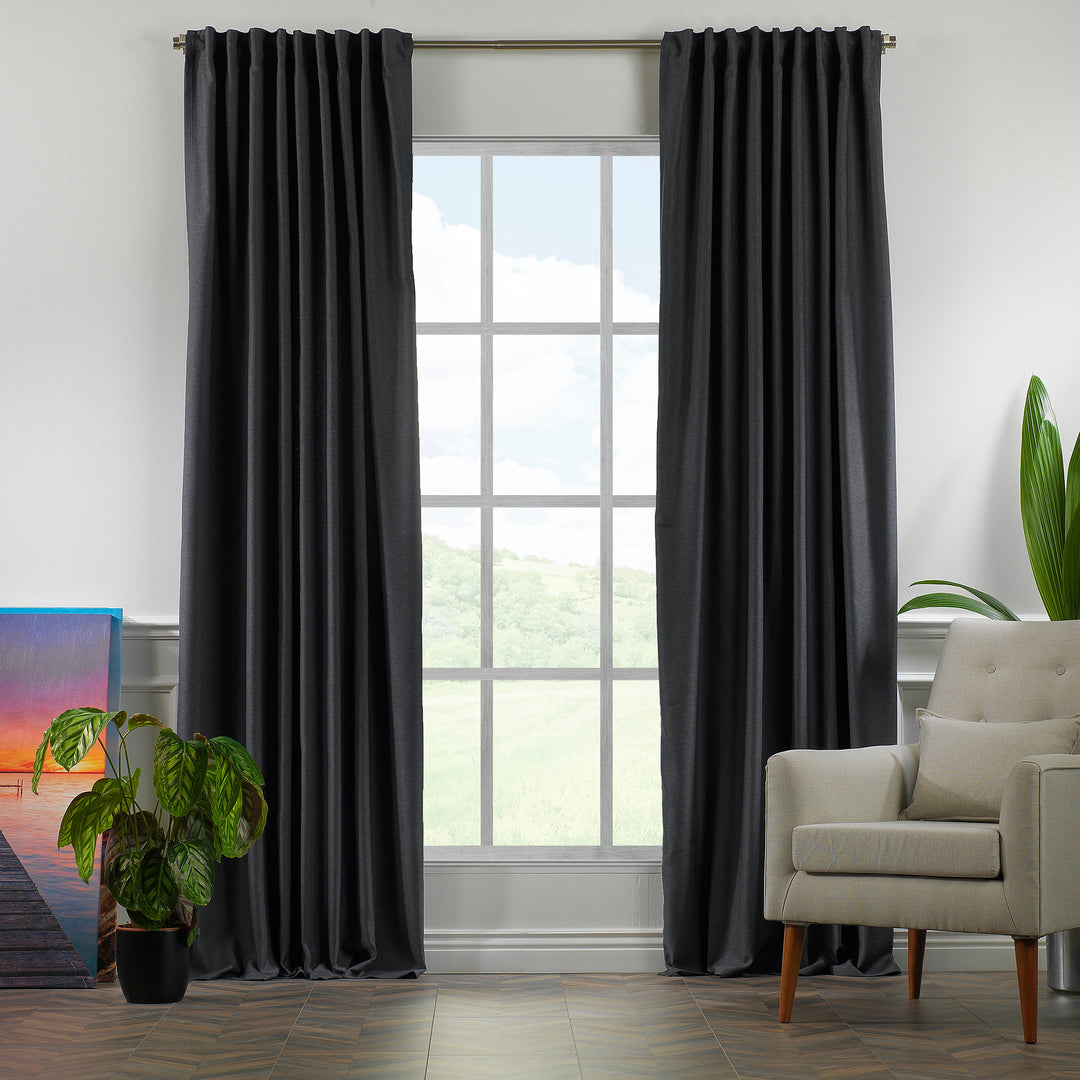 A made to measure linen‑look curtain in anthracite, displayed in daylight with textured weave and a clean structured drape