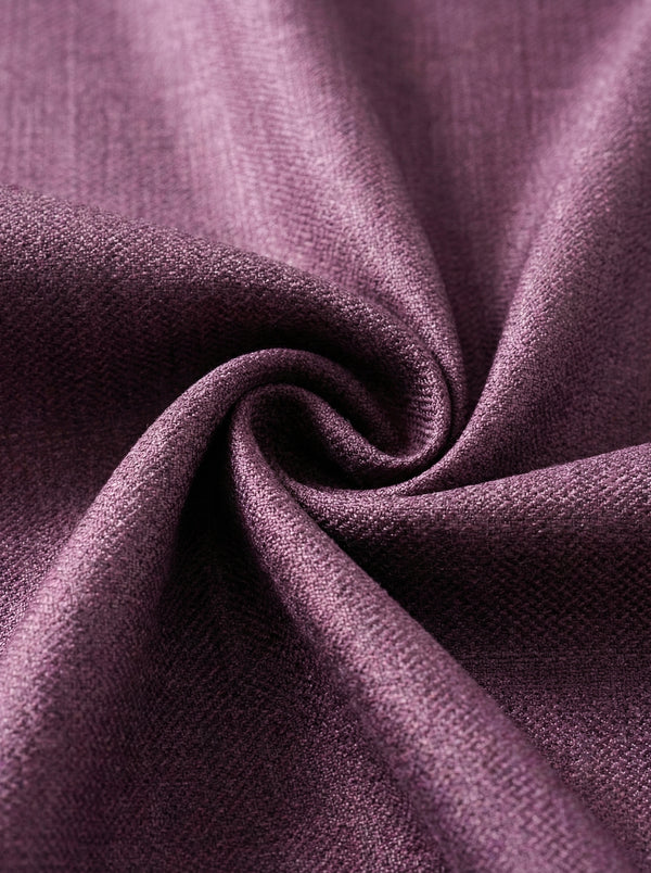 Close-up of purple linen curtains fabric with a textured pattern
