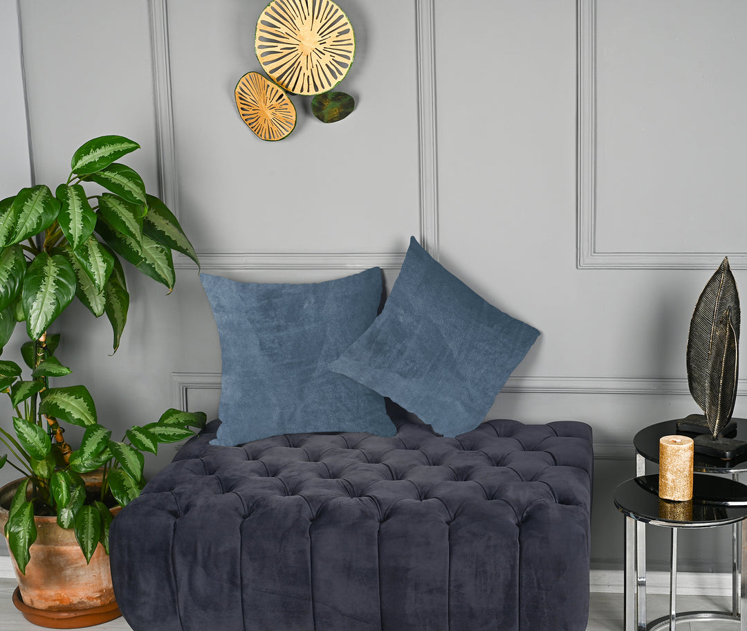 A made to measure cushion cover in muted steel‑blue matte velvet, shown with a smooth plush texture and crisp edges for a refined contemporary style