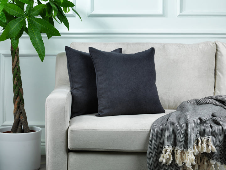 A made to measure cushion cover in dark anthracite linen‑look fabric, shown with a natural textured weave and crisp refined edges for a modern premium style