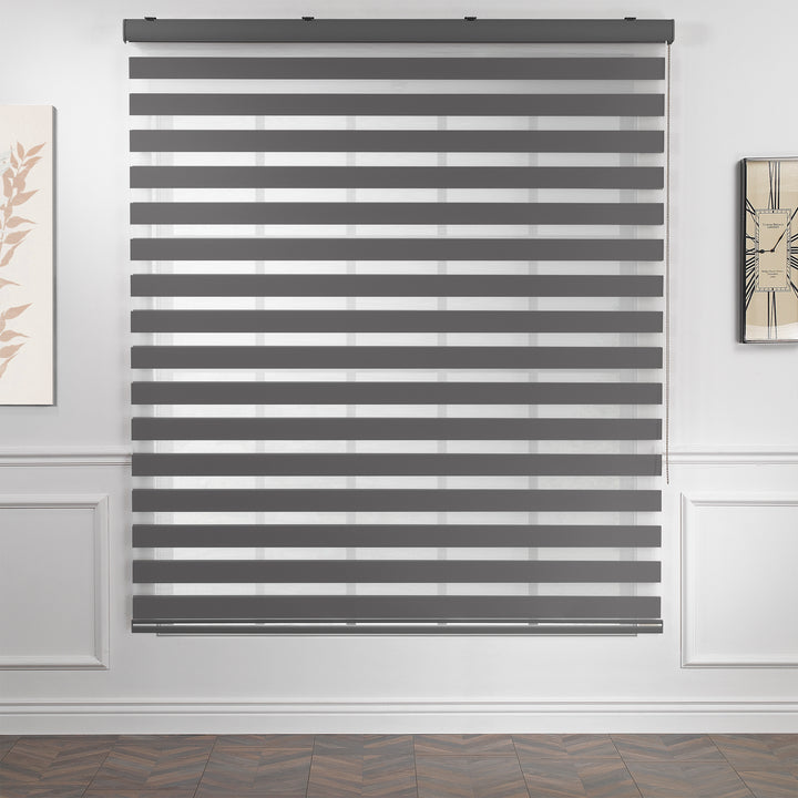 Made to measure anthracite zebra roller blind featuring deep smoky alternating sheer and dim‑out stripes for controlled light and enhanced privacy, highlighting its rich charcoal tone, smooth woven texture and sleek contemporary day‑and‑night blind design