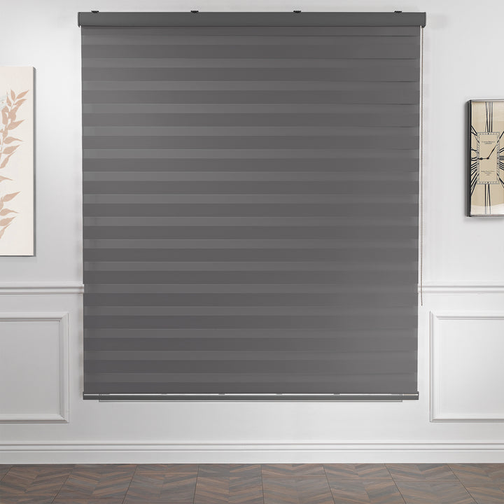 Made to measure anthracite zebra roller blind featuring deep smoky alternating sheer and dim‑out stripes for controlled light and enhanced privacy, highlighting its rich charcoal tone, smooth woven texture and sleek contemporary day‑and‑night blind design
