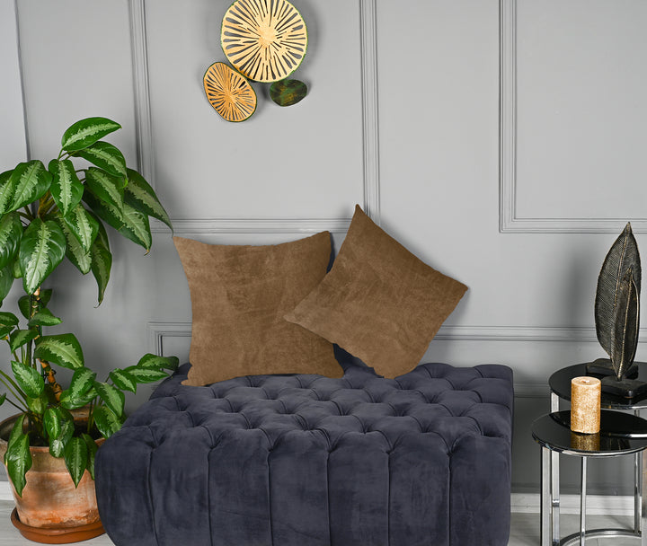 A made to measure cushion cover in warm antique‑brass matte velvet, shown with a soft low‑sheen surface and crisp structured edges for a rich elegant look