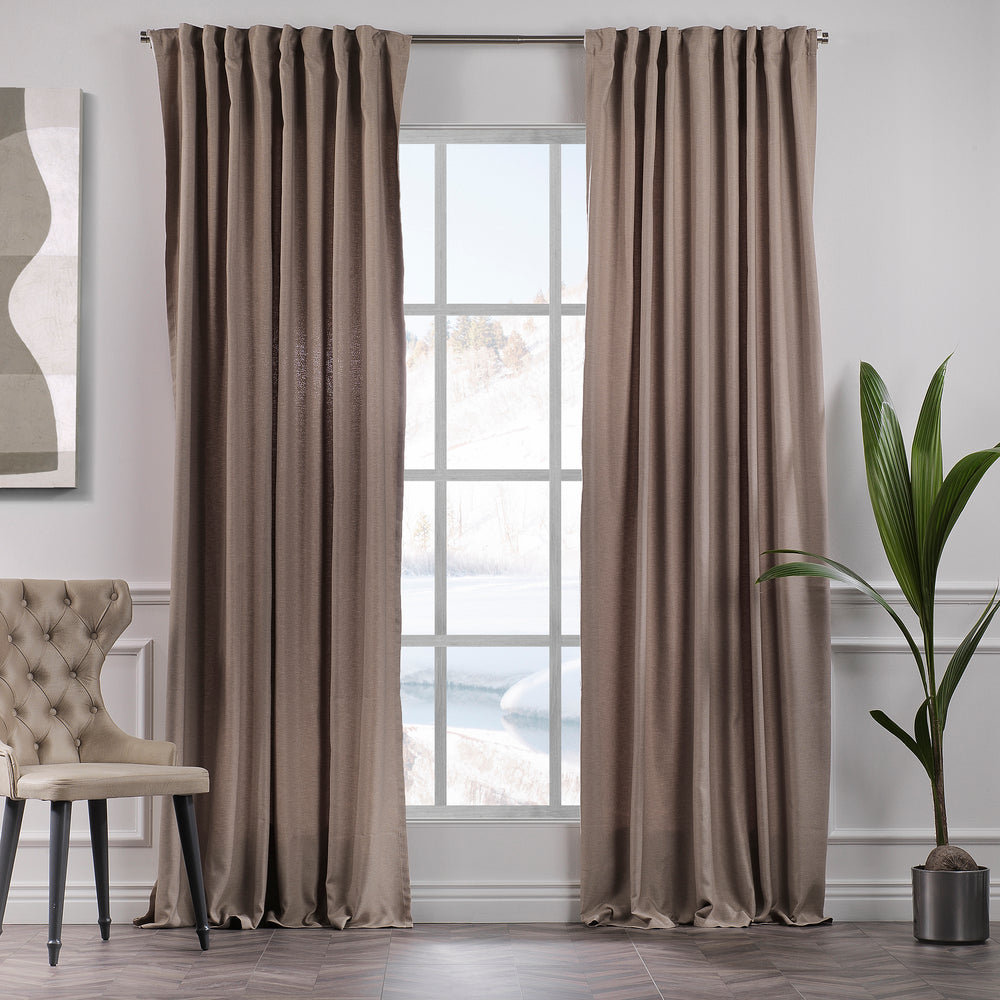  A made to measure linen‑look curtain in barley, photographed in daylight with subtle woven texture and a calm soft drape