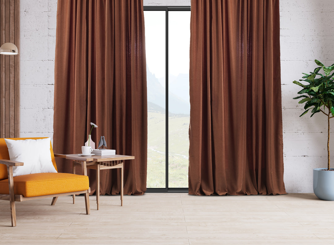 An extra‑long wide linen‑look door curtain in brick, displaying smooth tailored folds and a rich earthy daylight finish