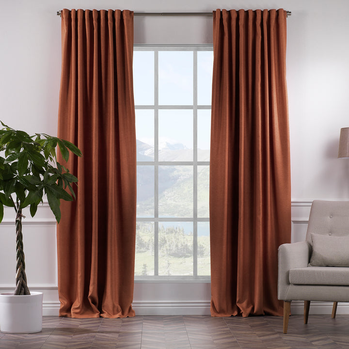  A made to measure linen‑look curtain in brick, shown in daylight with warm textured weave and a soft natural drape