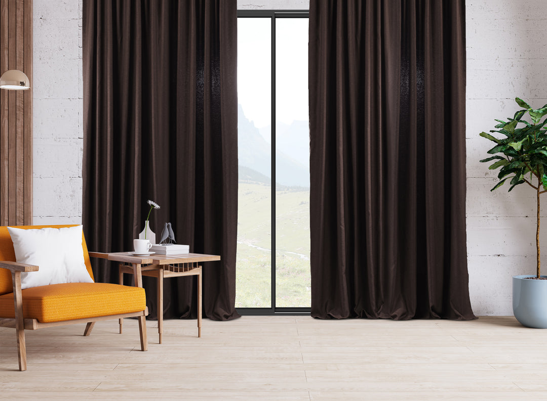 An extra‑long wide linen‑look door curtain in brown, highlighting smooth folds, daylight depth and a rich premium finish