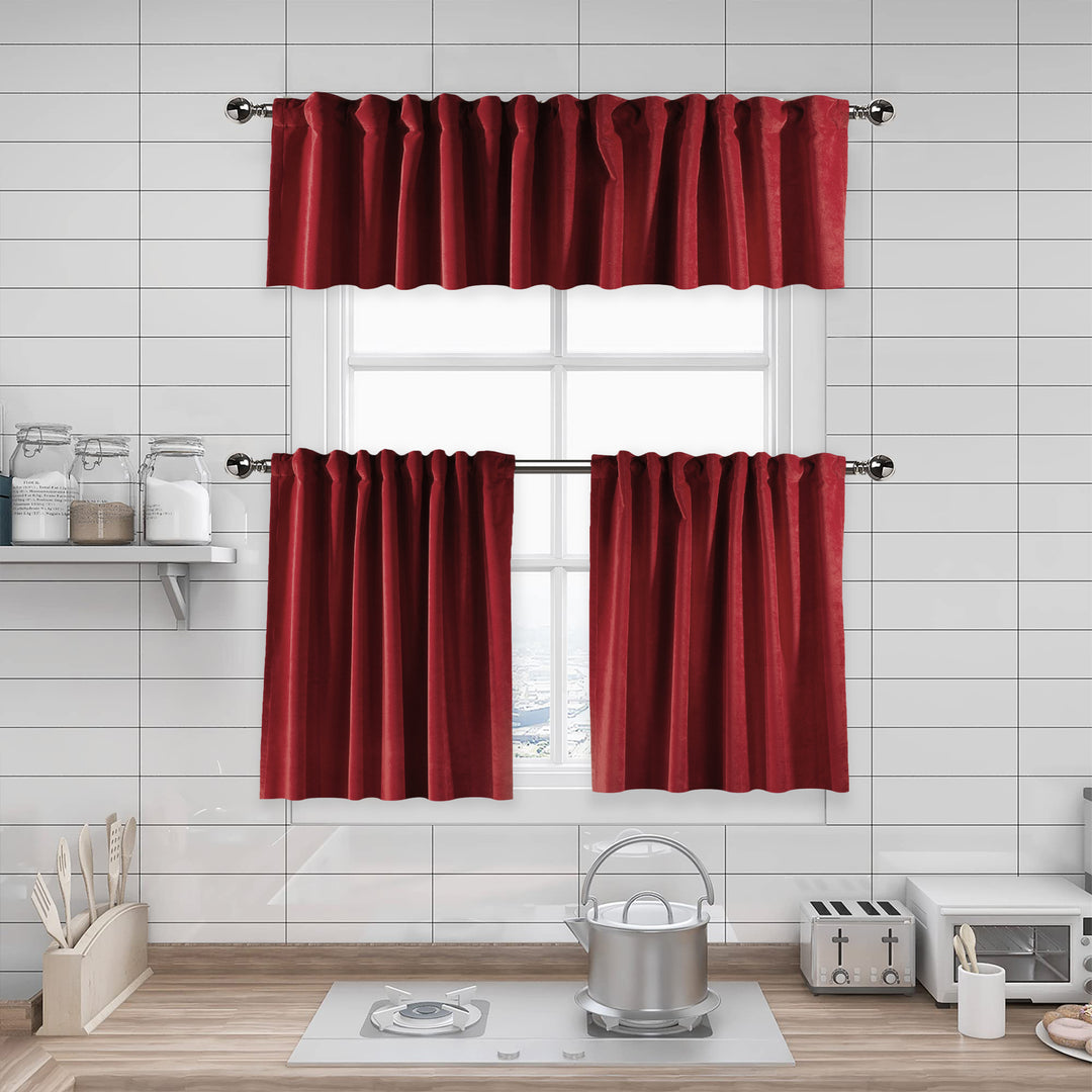 A made to measure kitchen valance in deep rustic‑red matte velvet, featuring a velvety surface and neatly tailored seams for a rich warm appearance
