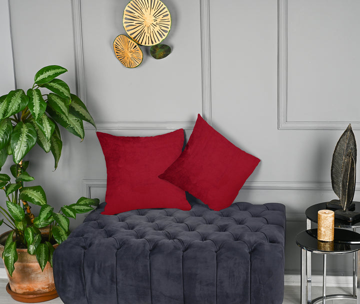 A made to measure cushion cover in deep rustic‑red matte velvet, shown with a smooth plush texture and neatly tailored edges for a rich warm finish