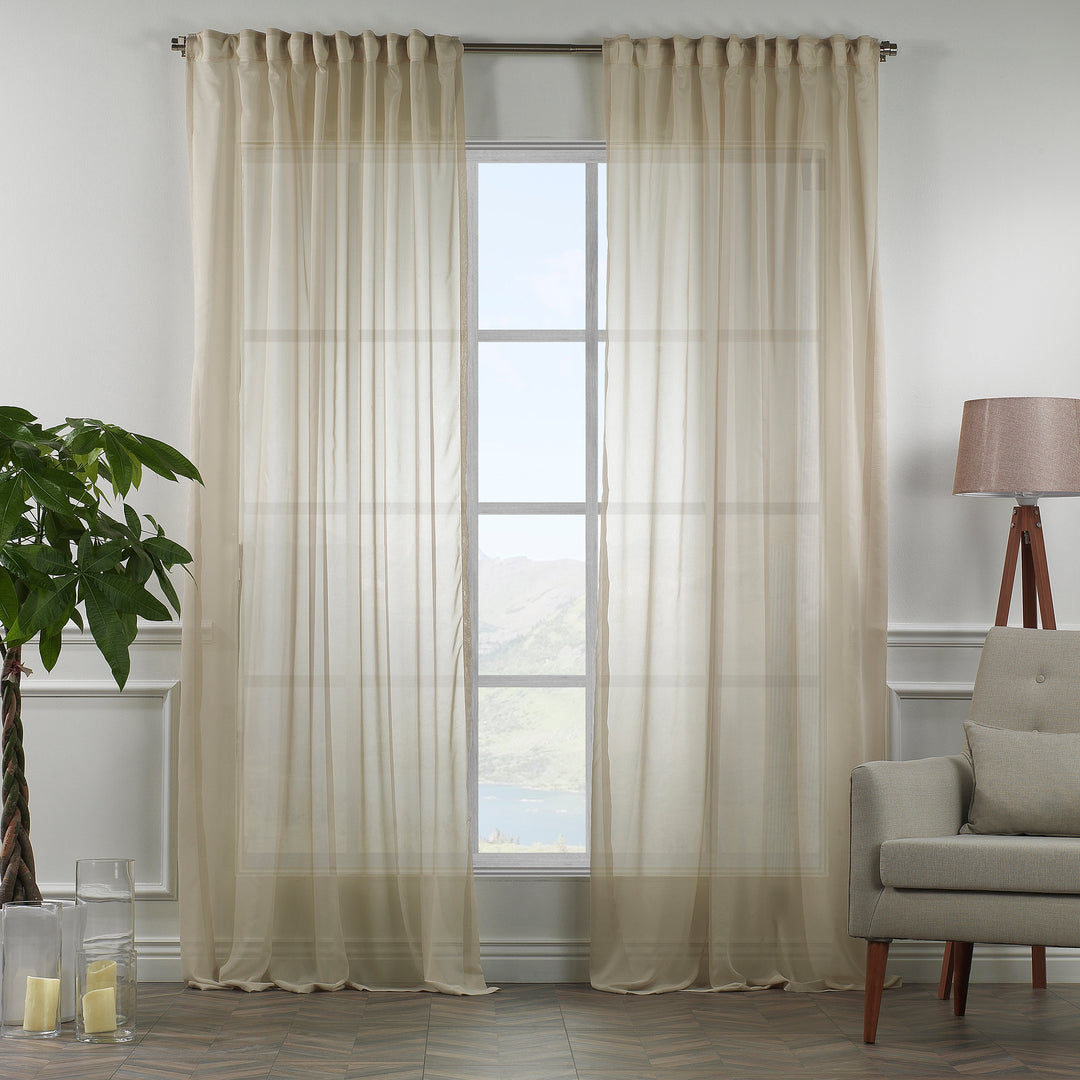 Made‑to‑measure extra‑long and extra‑wide Beige silk‑crepe sheer curtain in daylight, showing fine crepe texture, soft natural translucency and a smooth airy drape.