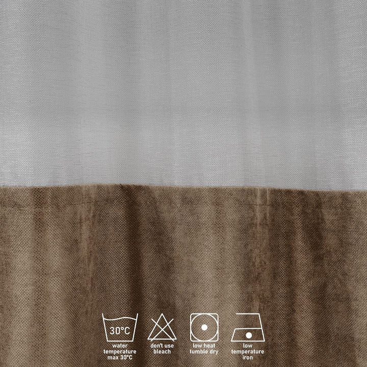 A close‑up of a beige velvet and sheer block curtain, displaying smooth velvet texture and the airy sheer underlayer