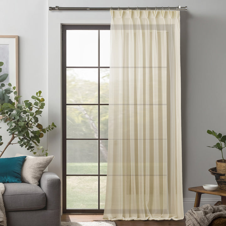 Beige silk‑crepe pinch‑pleated curtain in extra‑long and extra‑wide sizing, blending delicate crepe texture with elegant structured pleats and a smooth flowing drape.