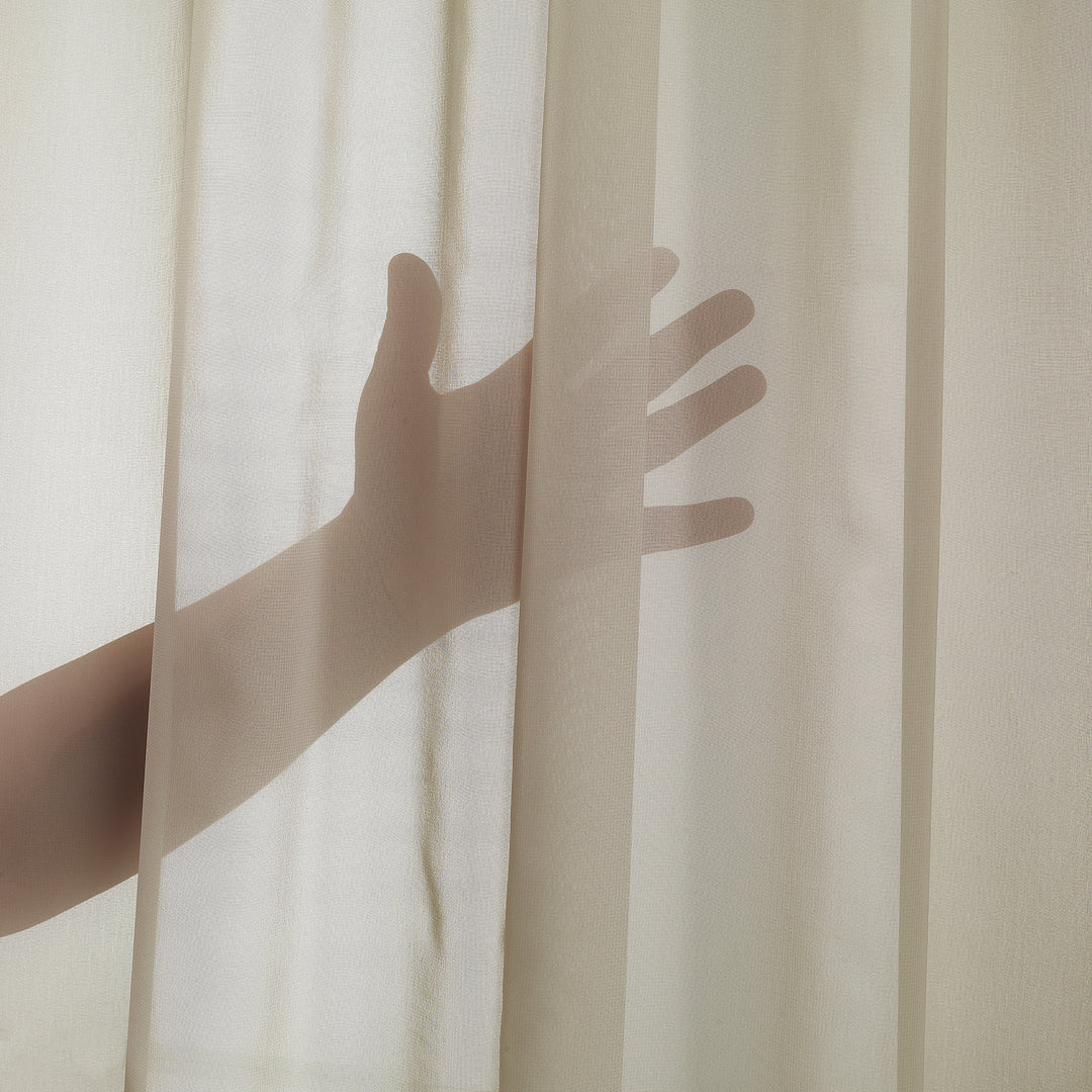 Close‑up of Beige silk‑crepe curtain showing fine crepe texture, refined pleated header and soft translucent light, made to measure.