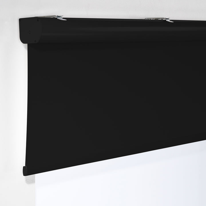  A detailed view of a black room darkening roller blind made to measure, showing its deep matte texture and clean refined weave