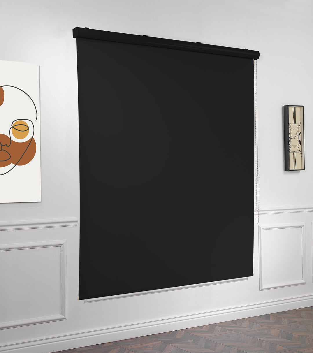 A made to measure black room darkening roller blind photographed from a soft angle with a smooth matte finish and tidy straight lines