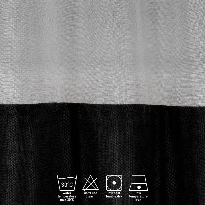 A close‑up of a black velvet and sheer block curtain, highlighting the soft velvet surface and light‑diffusing sheer panel