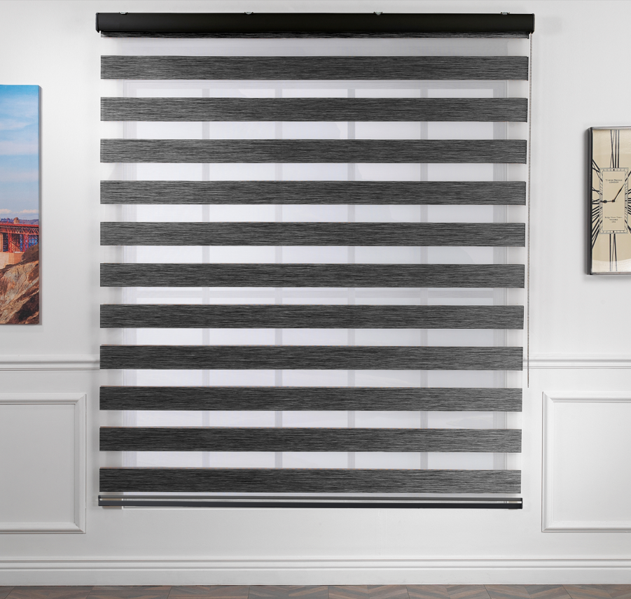Made to measure zebra roller blind in black, designed with alternating sheer and opaque horizontal stripes for adjustable light control and privacy, highlighting the bold black tone, smooth texture and modern day‑and‑night blind style.