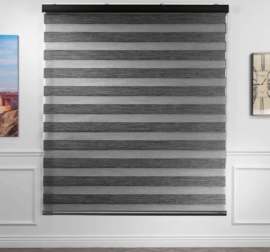 Made to measure zebra roller blind in black, featuring alternating sheer and opaque horizontal stripes for adjustable light control and privacy, showcasing the soft neutral tone, smooth texture and contemporary day‑and‑night blind design.
