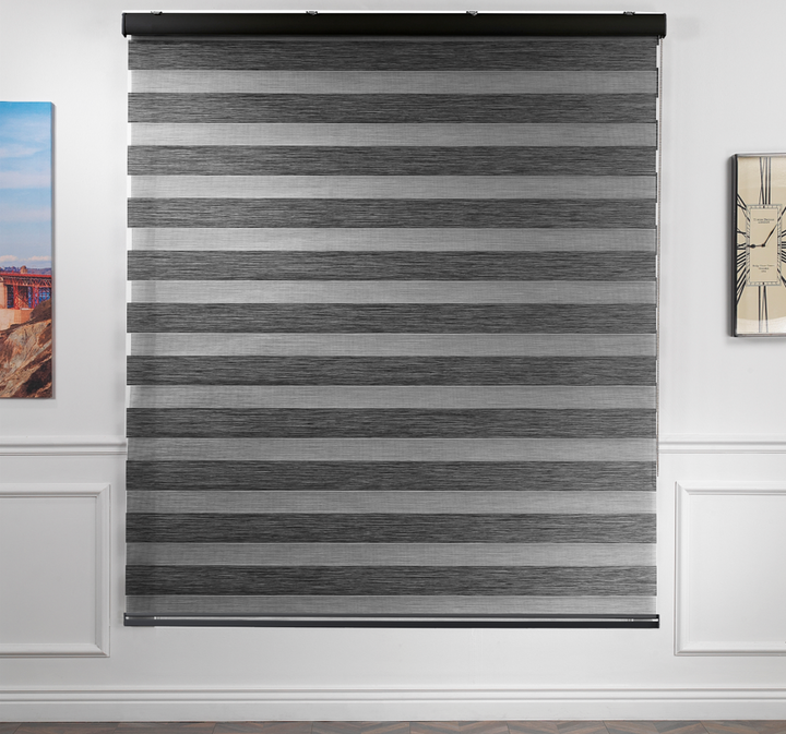 Made to measure zebra roller blind in black, featuring alternating sheer and opaque horizontal stripes for adjustable light control and privacy, showcasing the soft neutral tone, smooth texture and contemporary day‑and‑night blind design.